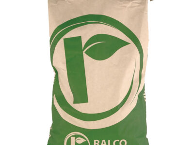 A large beige and green bag labeled "Easy Lax" with a stylized leaf logo and "RALCO Animal Nutrition" printed on the front. The bag appears full and is closed at the top.