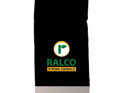 A black and white feed bag with the Ralco logo (green leaf inside a yellow circle) and "IntegraFlo for Beef" printed on the front.