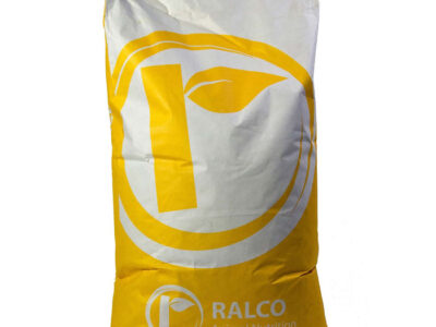 A large yellow and white bag labeled "Poultry Max Pure OMRI Listed" with a circular leaf logo, designed for animal feed or supplements.